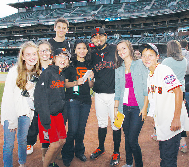 Image of a group of our FastForwad reporters posing Giants closing pitcher Sergio Romo