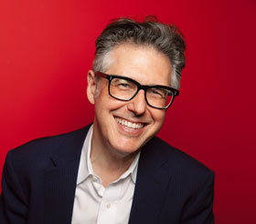 Headshot image of Ira Glass - photo credit: Sandy Honig