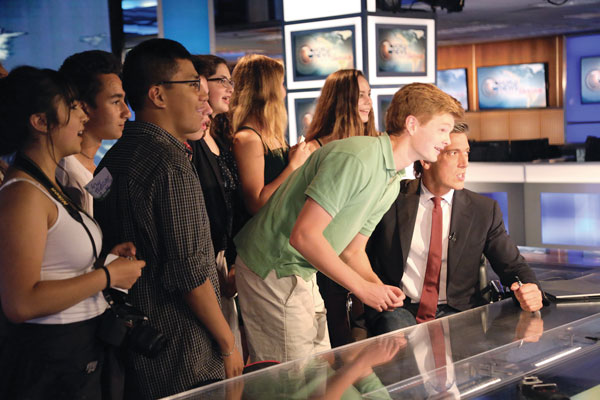 Image of David Muir with FastForward reporters