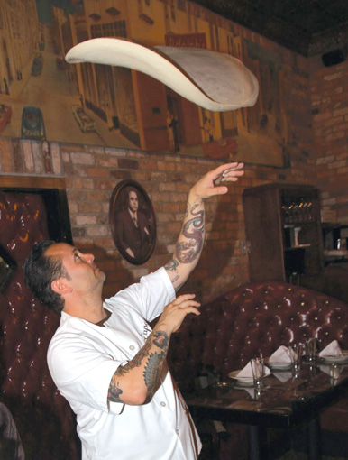 Image of Tony Gemignani demonstrating his pizza toss skills